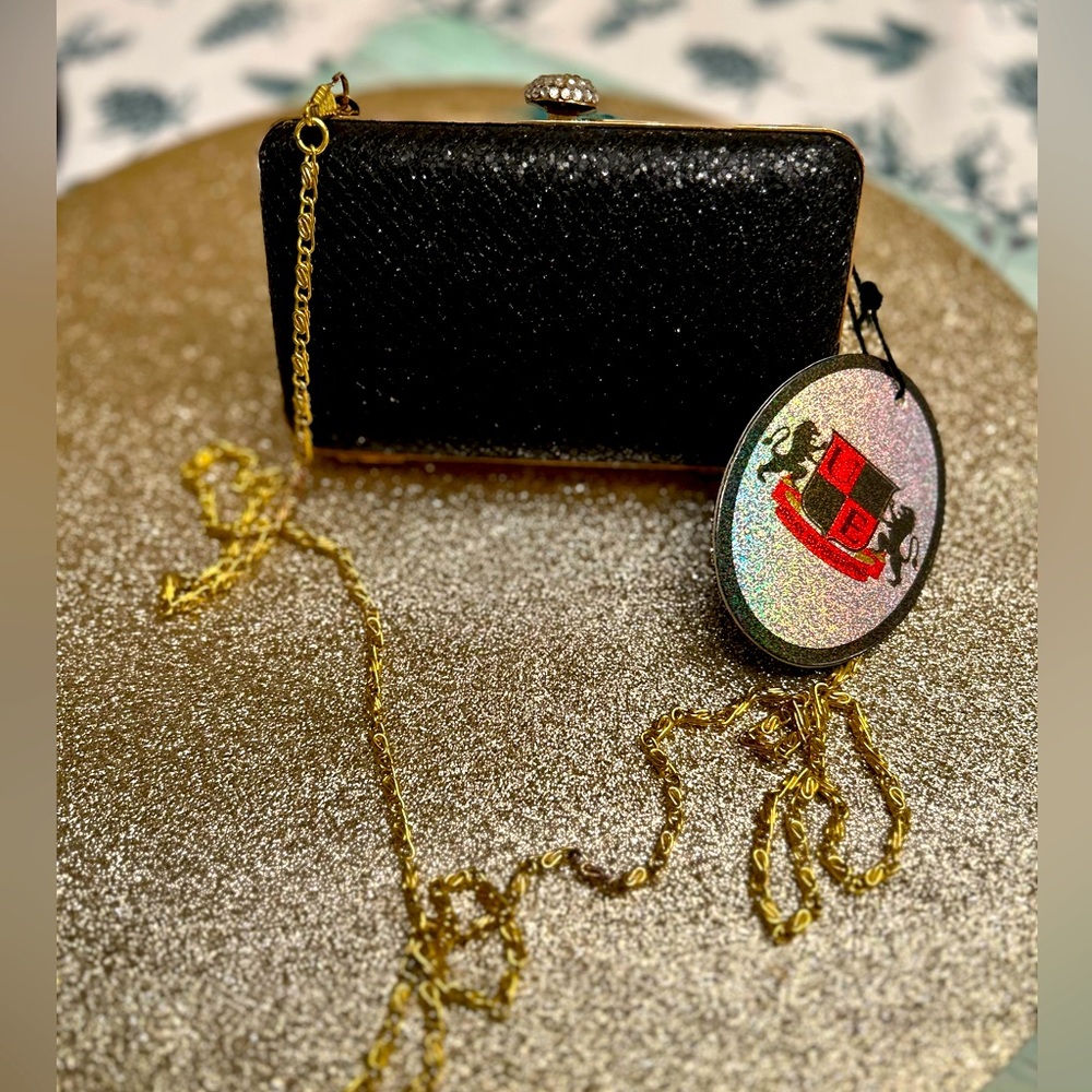 Brand new never used black with shimmer faux snake skin purse/clutch